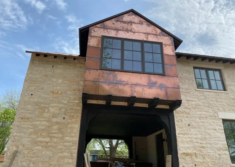 Copper metal panel facade on a stone building for Metal Roof Coating in Festus